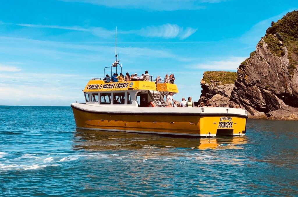 Hidden gems of the North Devon coast including Smugglers Caves, Broadsands Beach and Exmoor cliffs viewed from a boat trip near Ilfracombe