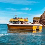 Hidden gems of the North Devon coast including Smugglers Caves, Broadsands Beach and Exmoor cliffs viewed from a boat trip near Ilfracombe